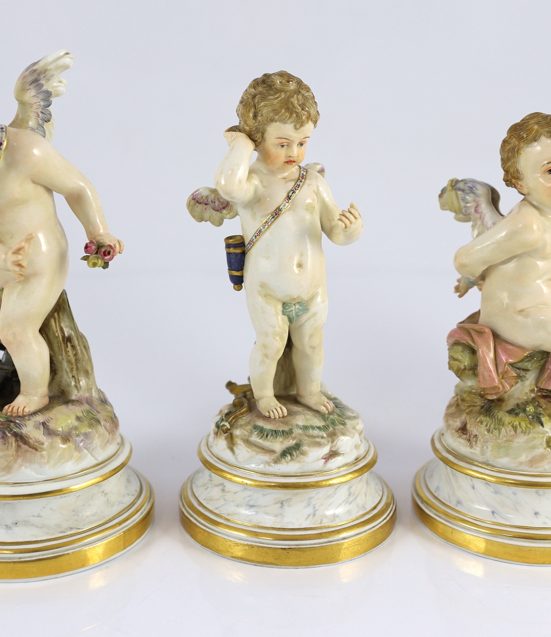 A series of five Meissen porcelain figures of Cupid, late 19th century, modelled by Heinrich Schwabe, 15.5cm - 20cm high, perplexed Cupid restored, Provenance - purchased from Winifred Williams, Eastbourne/London before